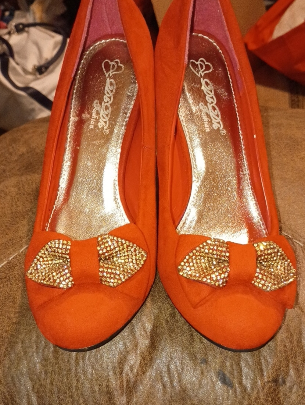 Guess Orange Bow Flats with Gold Crystal Accents